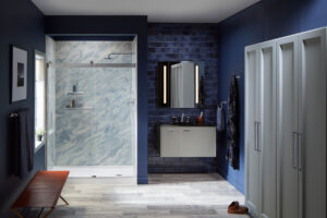 A gorgeous modern bathroom with blue walls and striking fixtures