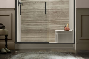 A walk-in shower with a built-in seat